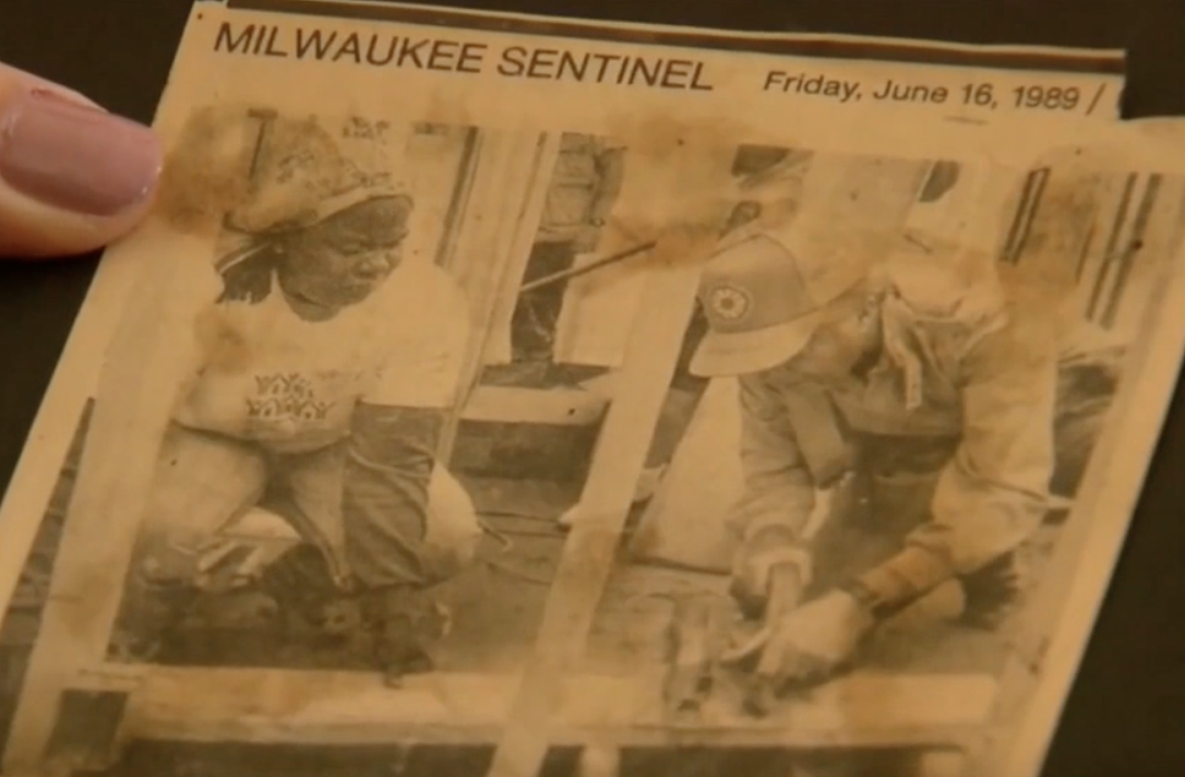 A newspaper clipping shows Cecelia Dukuly and President Jimmy Carter helping build a house in 1989.