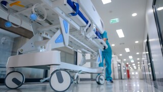 A,Hospital,Bed,Trolley,Being,Pushed,Down,A,Clean,,White